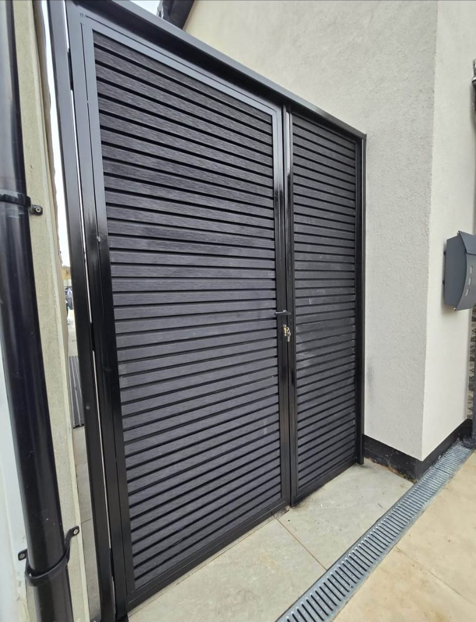 Steel-framed composite side gates